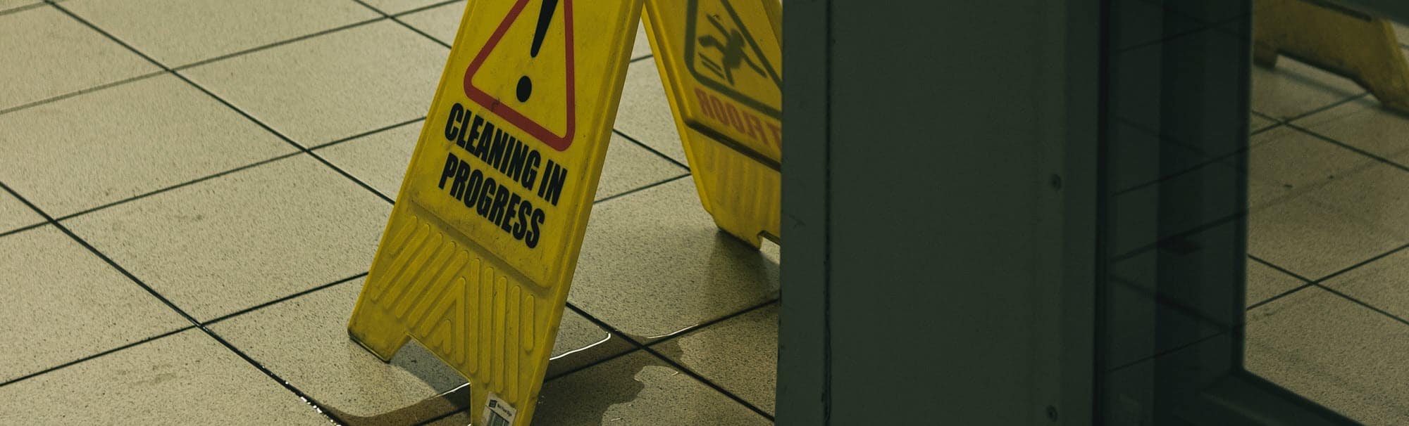 photo of wet floor with caution sign